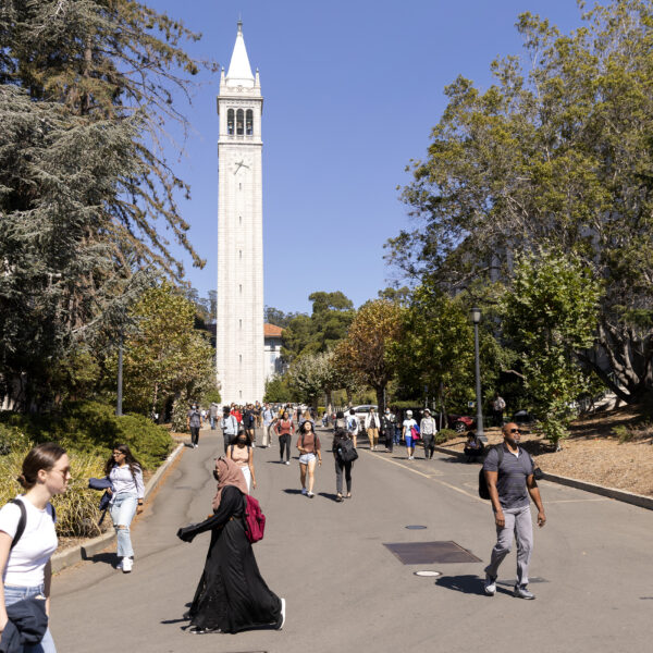 students walking on campus in front of Campanile