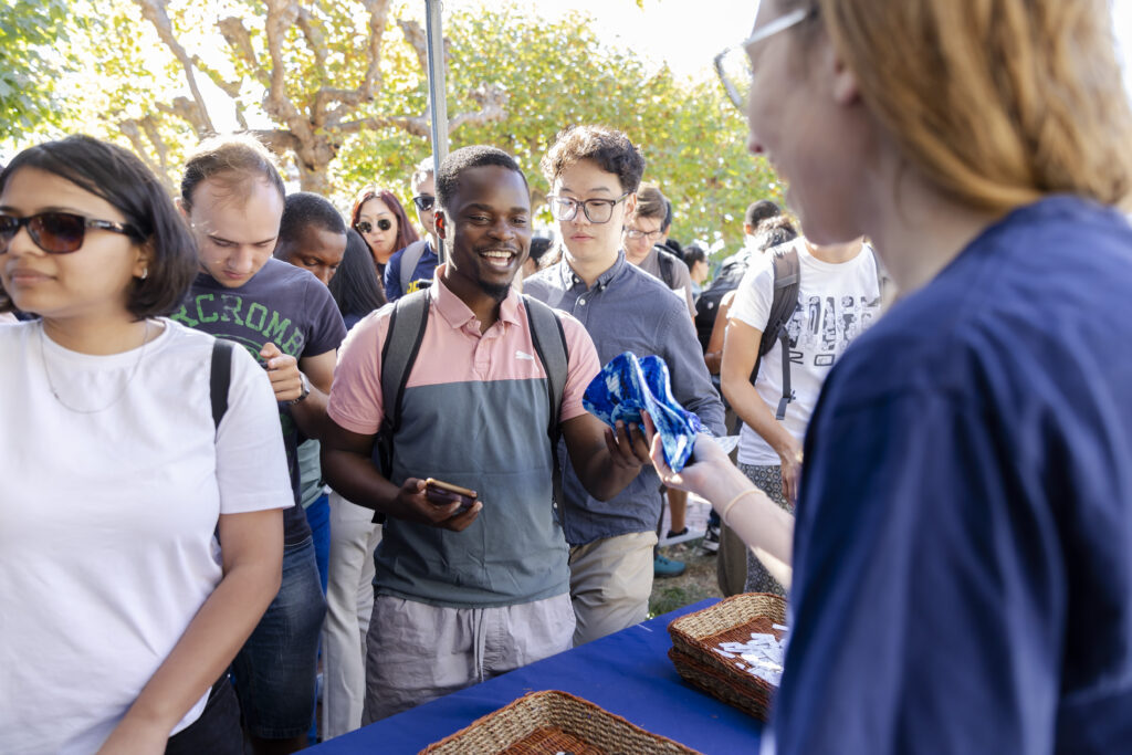 Student receives bucket hat prize.