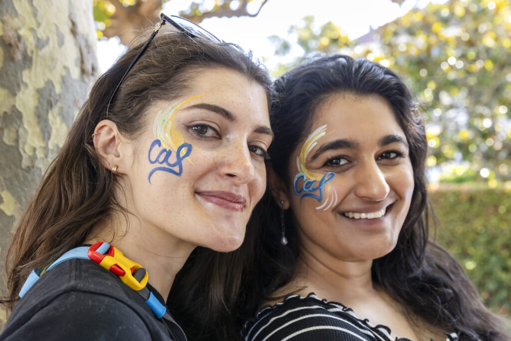 Two Grad Students with CAL themed face paint