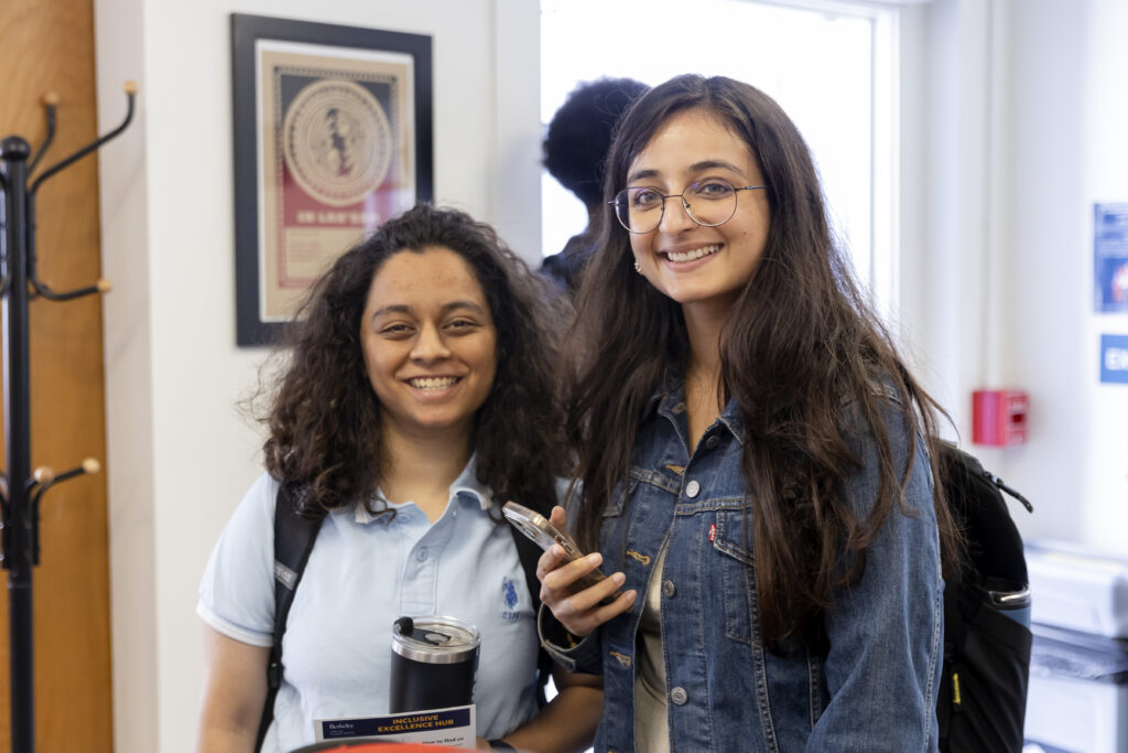 Two students stand together at the Inclusive Excellence Hub.