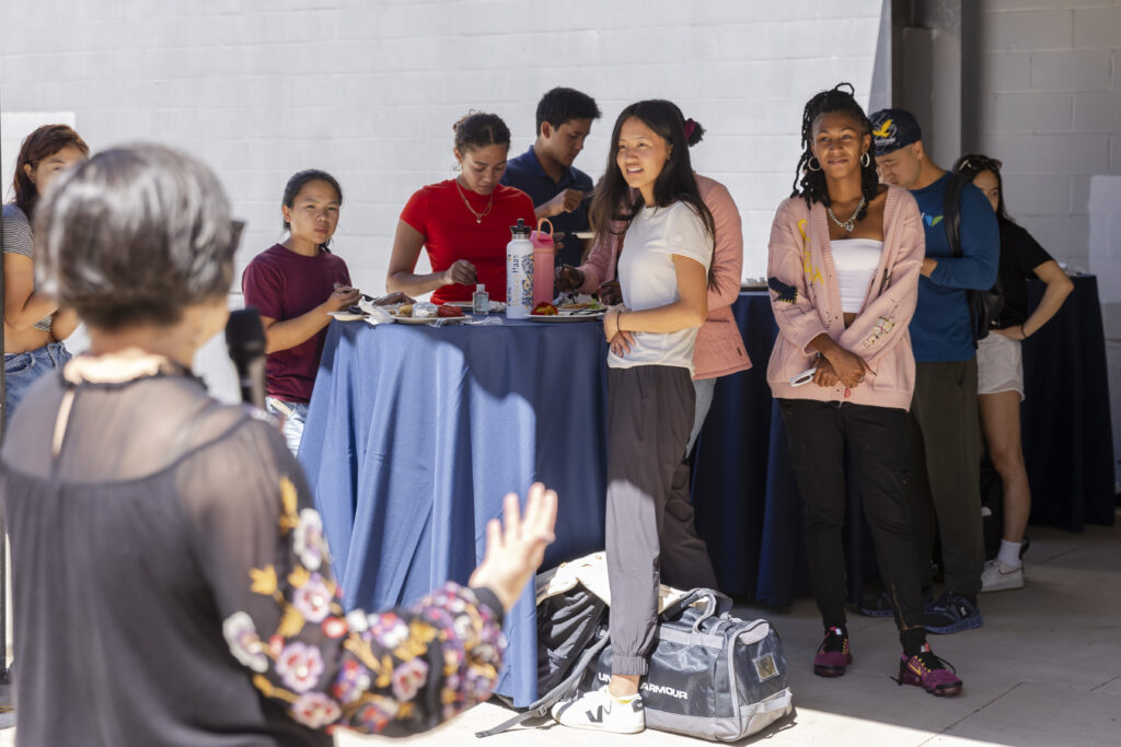 People listening to a talk at the Hub Open House