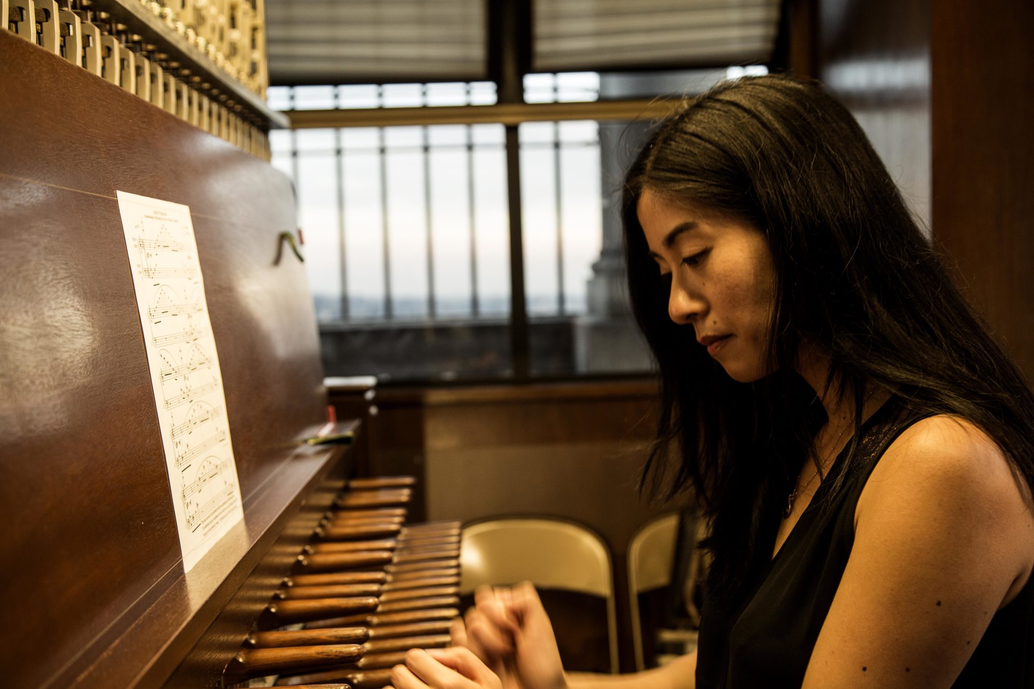 Photo of Tiffany Ng playing organ