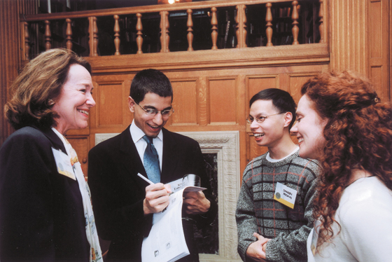 ARCS president Linda Dyer Millard (far left) and vice president Anne-Marie Fowler (far right) chat with scholars Kenneth Easwaran and Darren Hsiung in the Morrison Reading Room of the University Library at the Graduate Fellowship Receptio in April. 