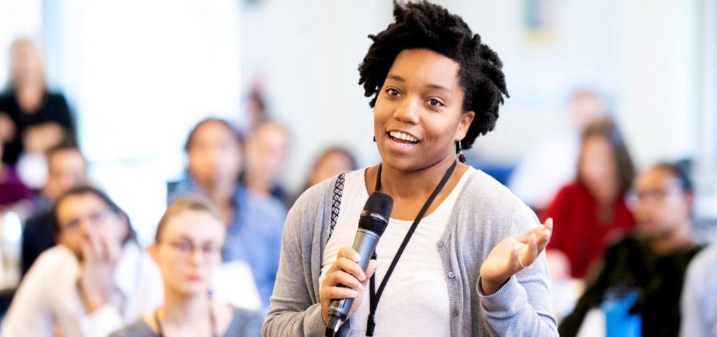 african american female student speaking over a microphone