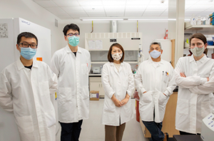 Justin Lee, Chi Zhu, Lei Xu, Federico Gonzalez and Caslin Gilroy in lab coats