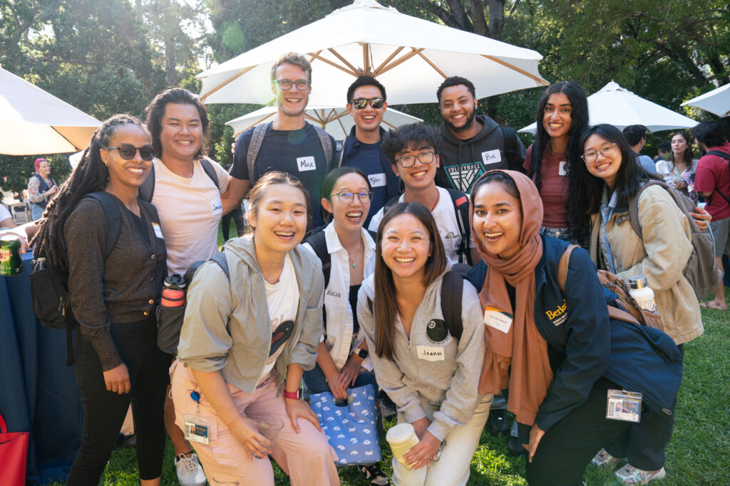 A group of grad students pose for a photo at the diversity welcome reception.