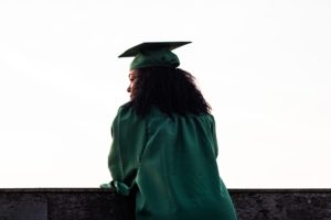 a graduate in a cap and gown
