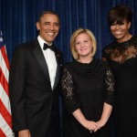 Angela Hart posing with Barack Obama