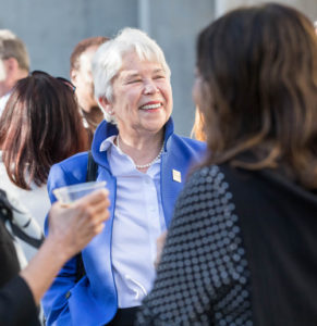 Chancellor Carol Christ smiling in a crowd of people
