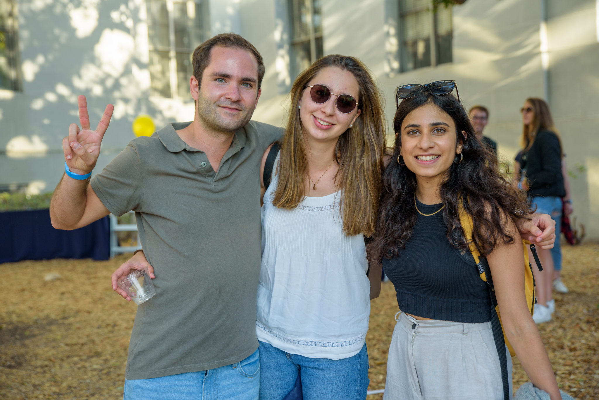three graduate students standing in front of sproul hall