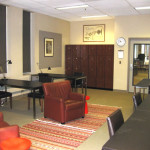 Photo of room with coach and table and chairs