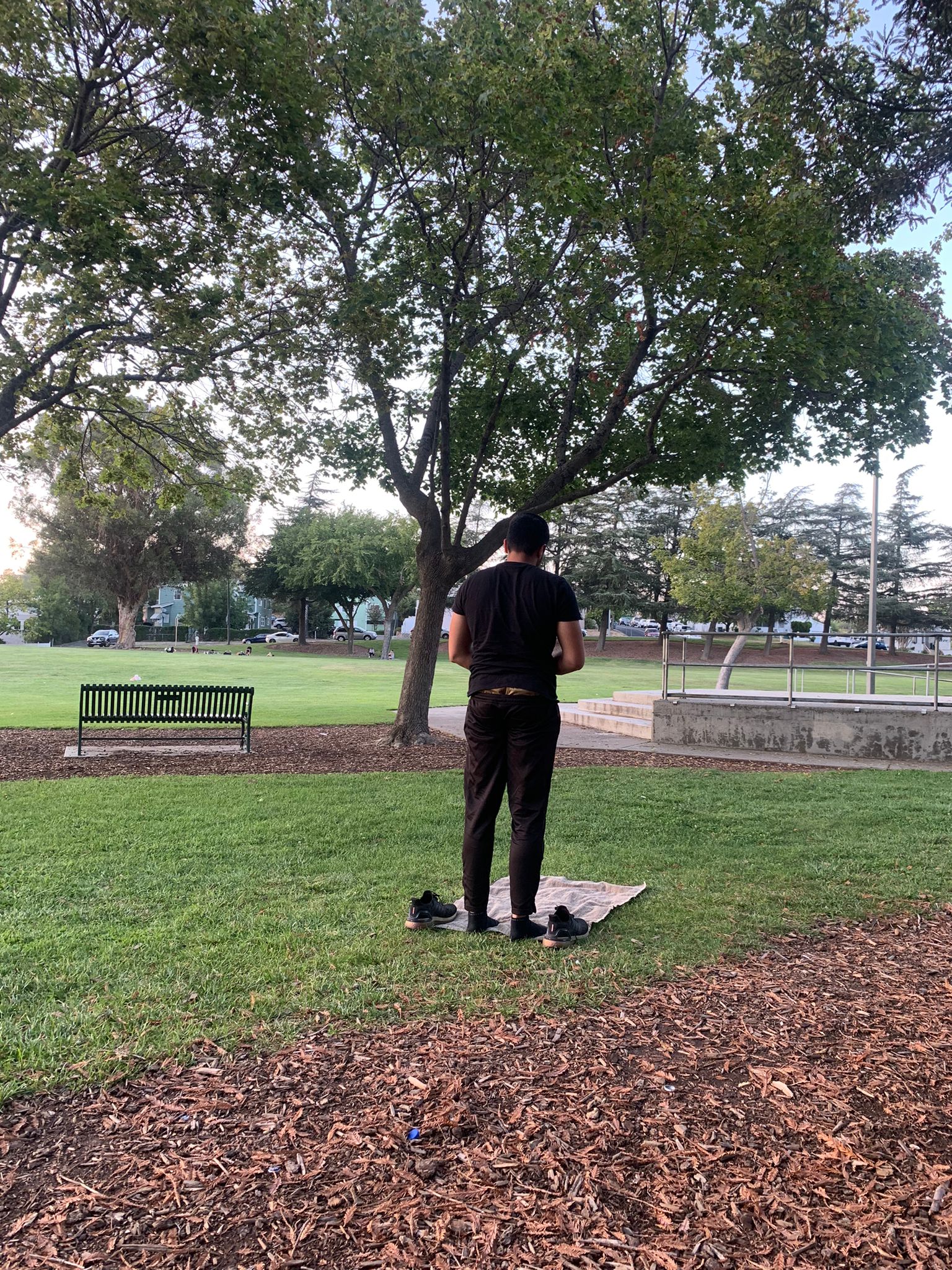 Haider-Ali-Bhatti praying in a park