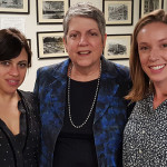 Photo of Janet Napolitano posing with two students