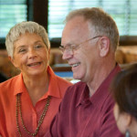 Two older people laughing