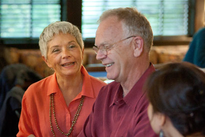 Two older people laughing